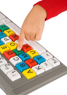 Child's finger on BigKeys keyboard